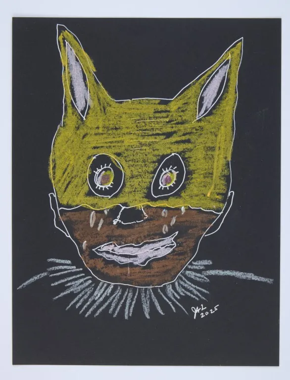 A drawing on black paper. A stylized face is shown, with a yellow head and white, pointed ears that resemble a cat or a rabbit. The face has large, wide eyes with brown irises and a white outer ring. The mouth is a jagged, white line. Below the yellow mask, the lower part of the face is brown, with several white lines resembling tears. The figure wears a ruffled, spiky collar drawn with white lines. The artist's signature and the year '2025' are in the bottom right corner.