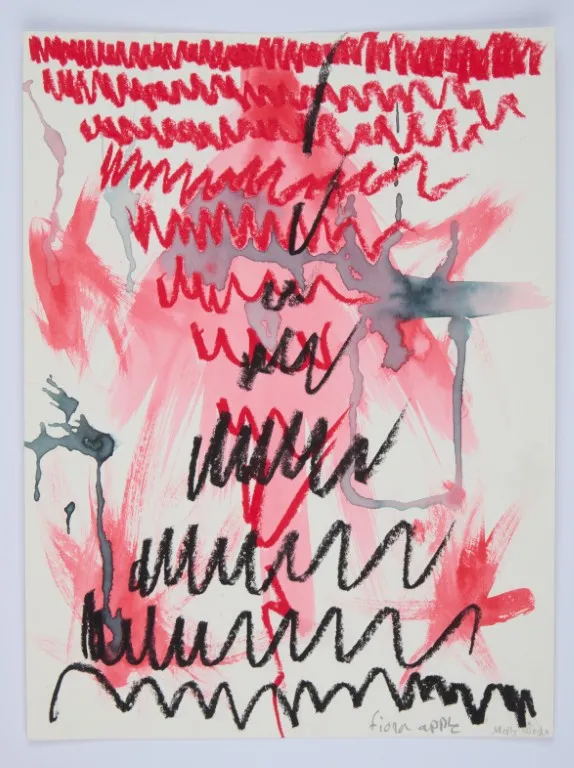An abstract drawing and watercolor painting on a white sheet of paper. The piece is dominated by bold, expressive marks in red, pink, and black. There are large, loose watercolor washes in various shades of red. Overlaid on top are thick, squiggly lines drawn in black and red crayon or pastel. Several dark gray splotches and drips of watercolor run vertically down the page. The phrase "fiona apple" is written in black script at the bottom, along with a signature.
