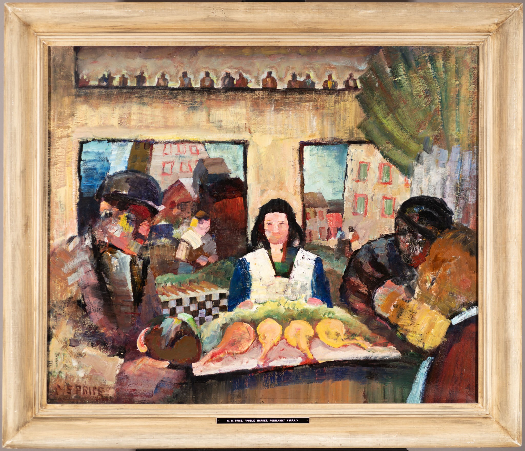 An oil painting in a wooden frame depicting a bustling public market scene. A woman with dark hair, wearing a white apron, stands behind a stall displaying various cuts of meat. To her left, a man in a hat and dark clothing appears to be engaged in conversation, while to the right, two figures, one wearing a headscarf, examine the goods. The background features a checkered table, market stalls, buildings with red roofs, and a row of small bottles on a shelf above. The painting is executed in a bold, express