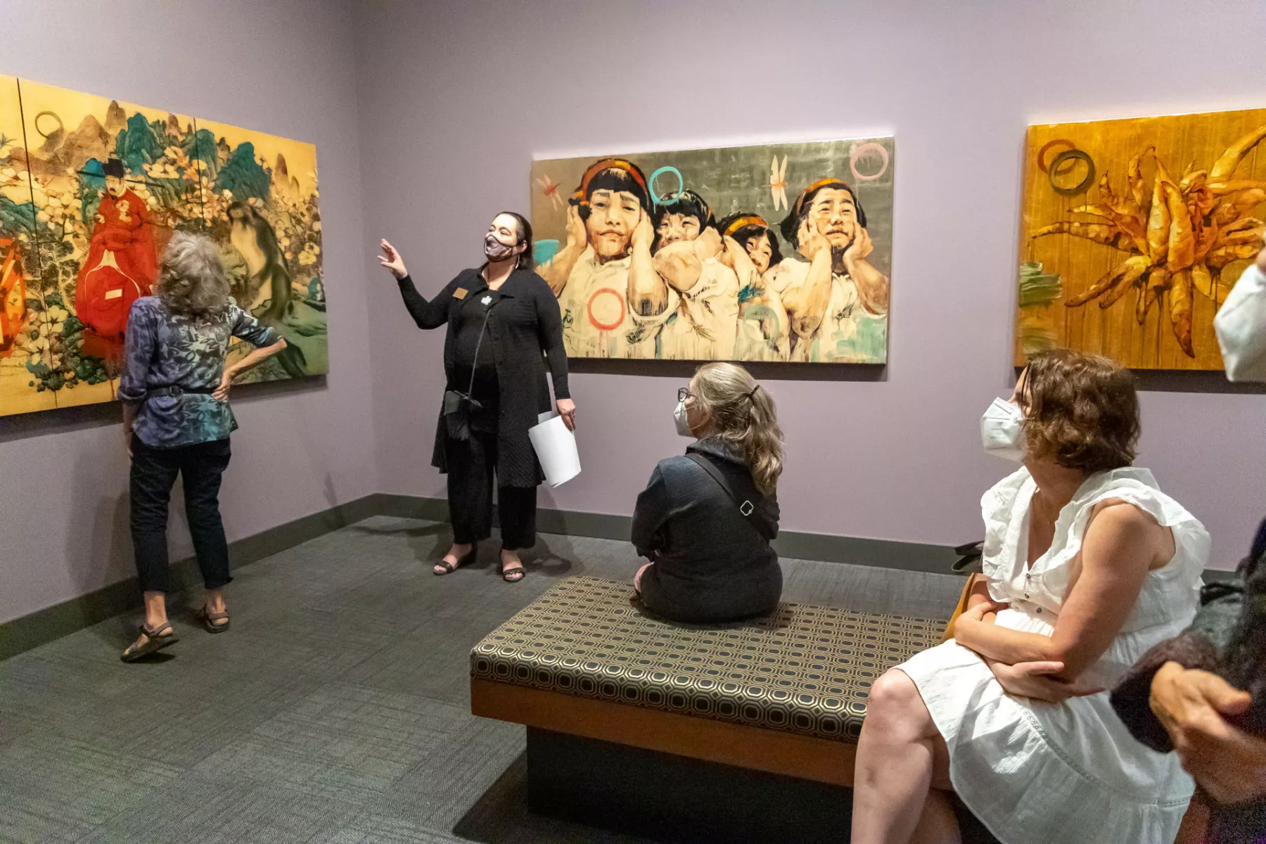 Curator leads a tour of Hung Liu artwork.