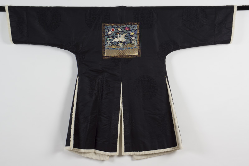 Fur lined black silk damask; rank badge embroidered with polychrome and gold-wrapped thread - Reverse view